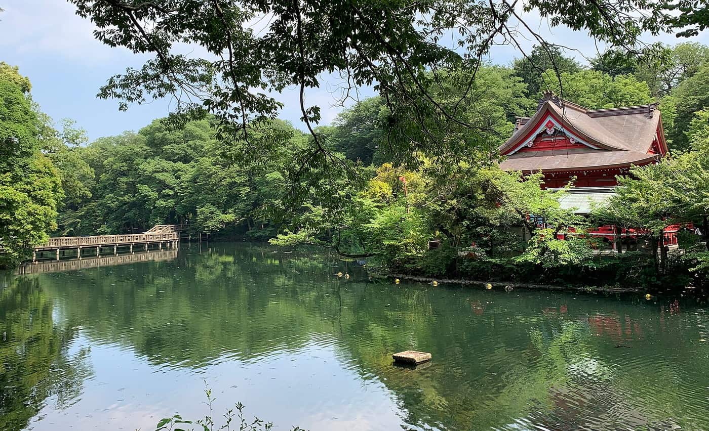 The red Benzaiten shrine hall on the edge of Inokashira Park pond in Kichijoji