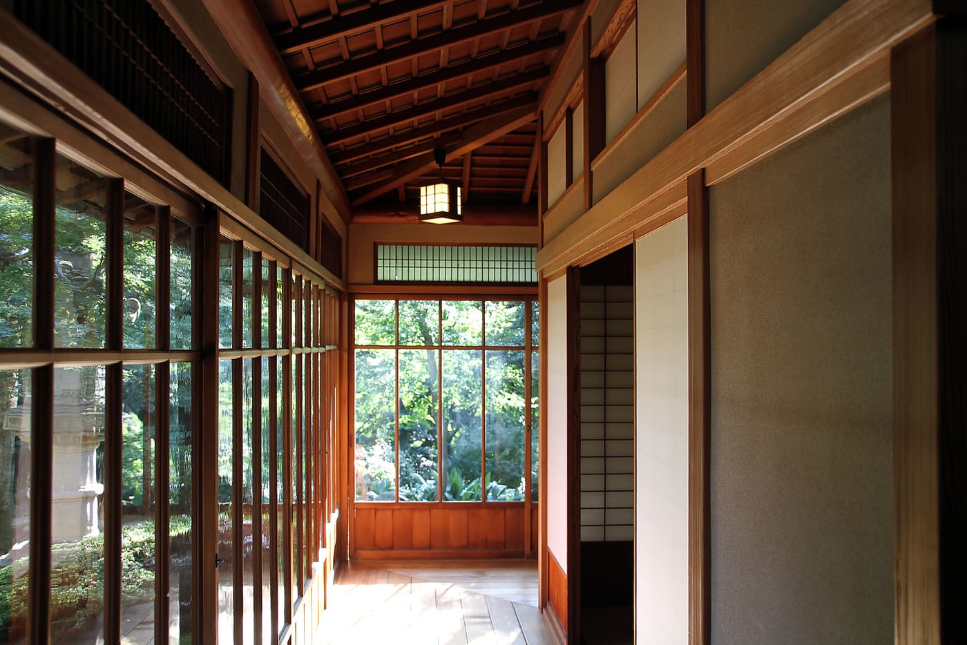 Wooden corridor of the 1919 Kyu Asakura House looking out to its garden in Daikanyama