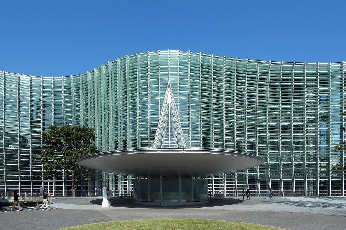Wave-shaped glass facade and entrance cone of The National Art Center, Tokyo in Roppongi