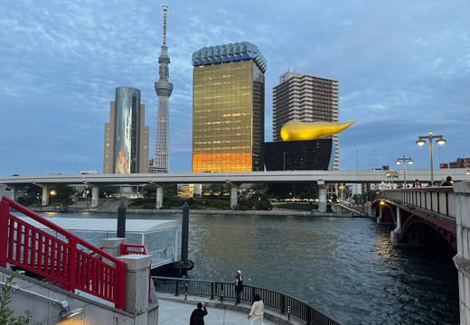Sumida River at Azuma Bridge in Asakusa with the Asahi flame and Tokyo Skytree