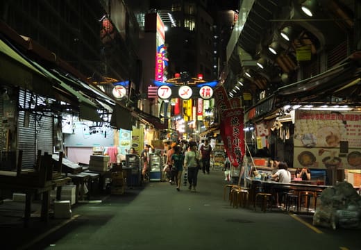Quiet stretch of Ameyoko beside the elevated railway tracks at night, Ueno