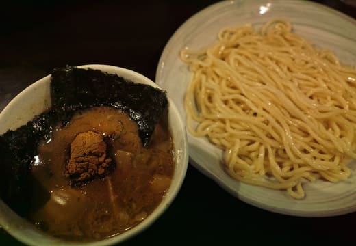 Thick tsukemen noodles beside the fish powder topped dipping broth at Fuunji, Shinjuku