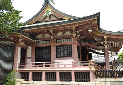 Side view of the ornate worship hall of Imado Shrine under blue sky, Asakusa
