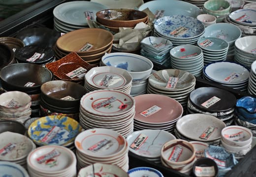 Stacks of patterned ceramic bowls for sale at a tableware shop on Kappabashi-dori