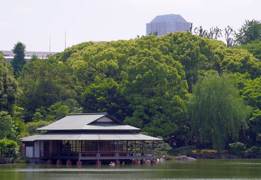 Ryotei teahouse built out over the large pond of Kiyosumi Gardens in early summer