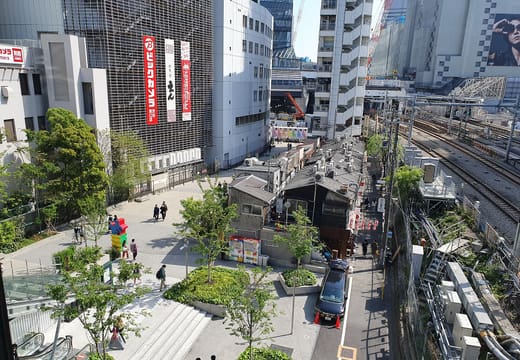 Rooftop lawns and walkways of Miyashita Park above Shibuya beside the railway tracks