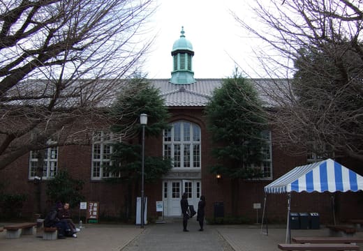 Brick main dining hall with a green cupola on the Rikkyo University Ikebukuro campus