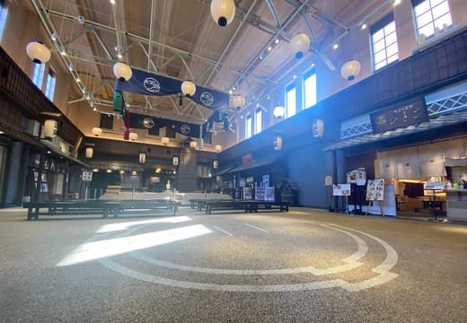 Daylight falling on the sumo ring floor inside the old Ryogoku station building at Edo Noren