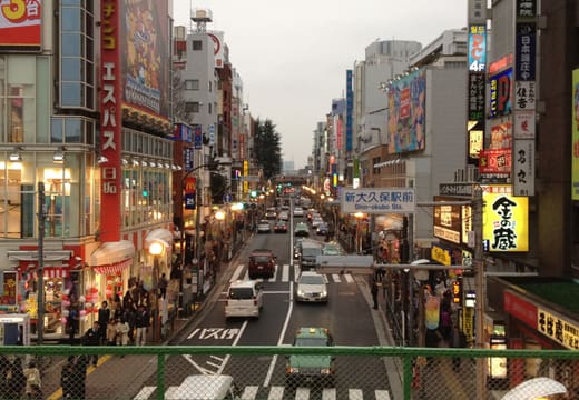Okubo-dori in Shin-Okubo lined with Korean restaurant and shop signs at dusk