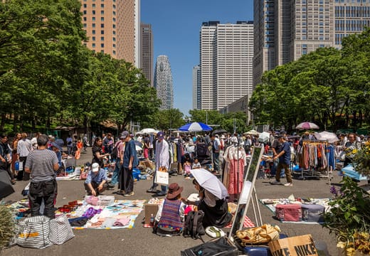 Weekend flea market stalls under the West Shinjuku skyscrapers in Shinjuku Chuo Park