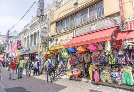 Rainbow-coloured clothing and accessory shops lining Takeshita Street, Harajuku