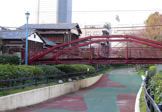 Red iron Hachiman-bashi bridge near Tomioka Hachimangu, a Meiji-era truss bridge