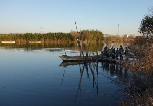 Wooden ferry landing and moored boat at the Yagiri no Watashi crossing on the Katsushika bank