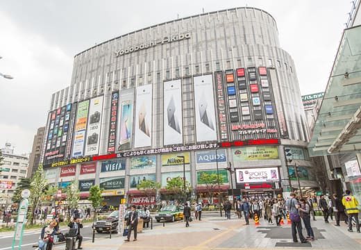 Daytime facade of the Yodobashi Camera Multimedia Akiba store with shoppers outside