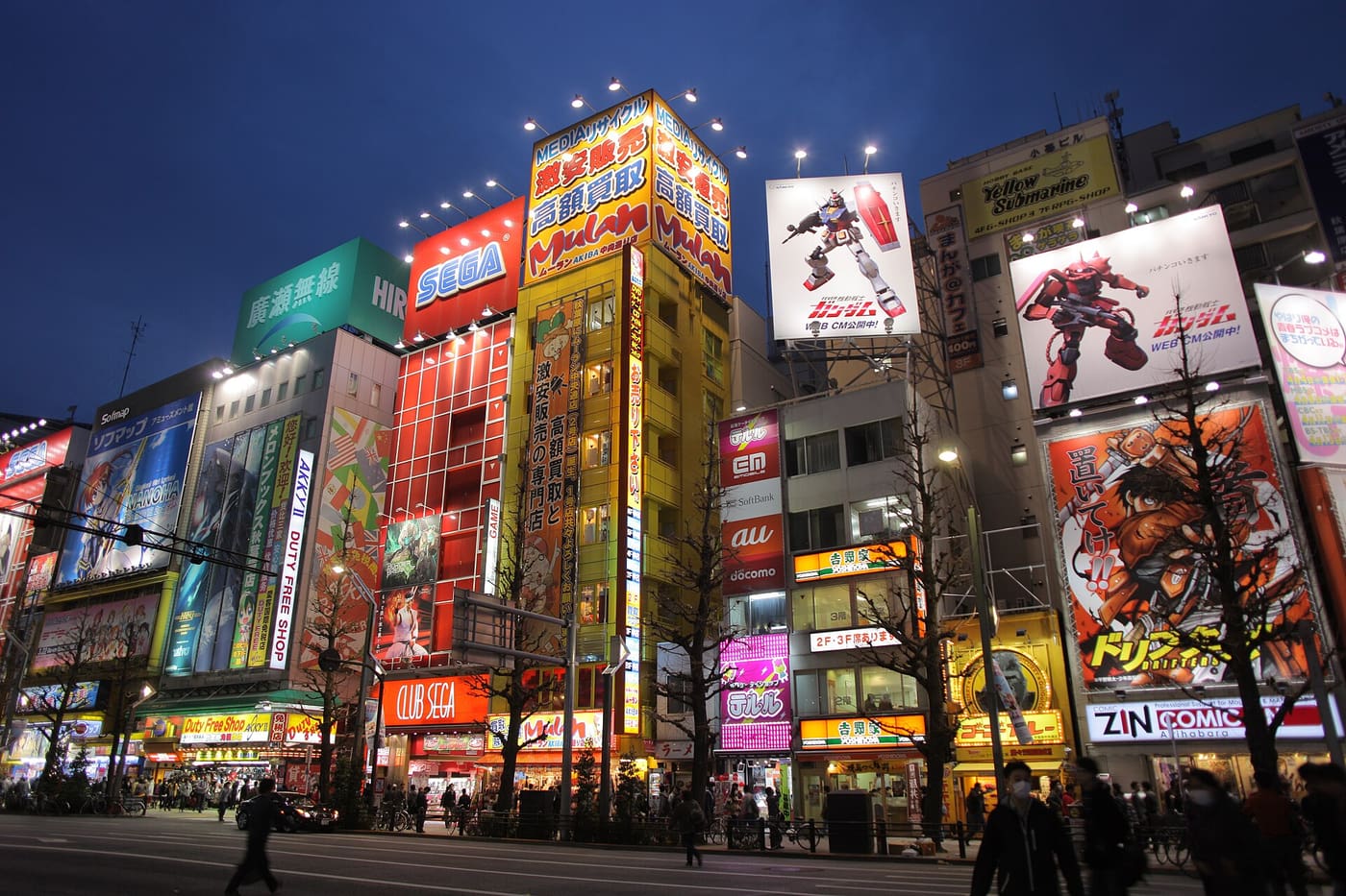 Neon-covered electronics and anime stores along Chuo-dori in Akihabara at dusk