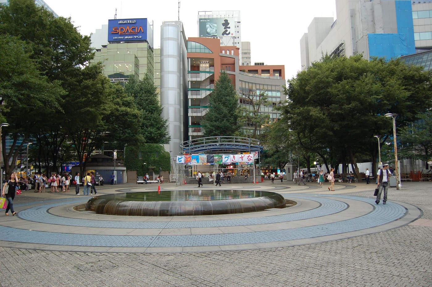 The fountain plaza of Ikebukuro West Gate Park in front of the station