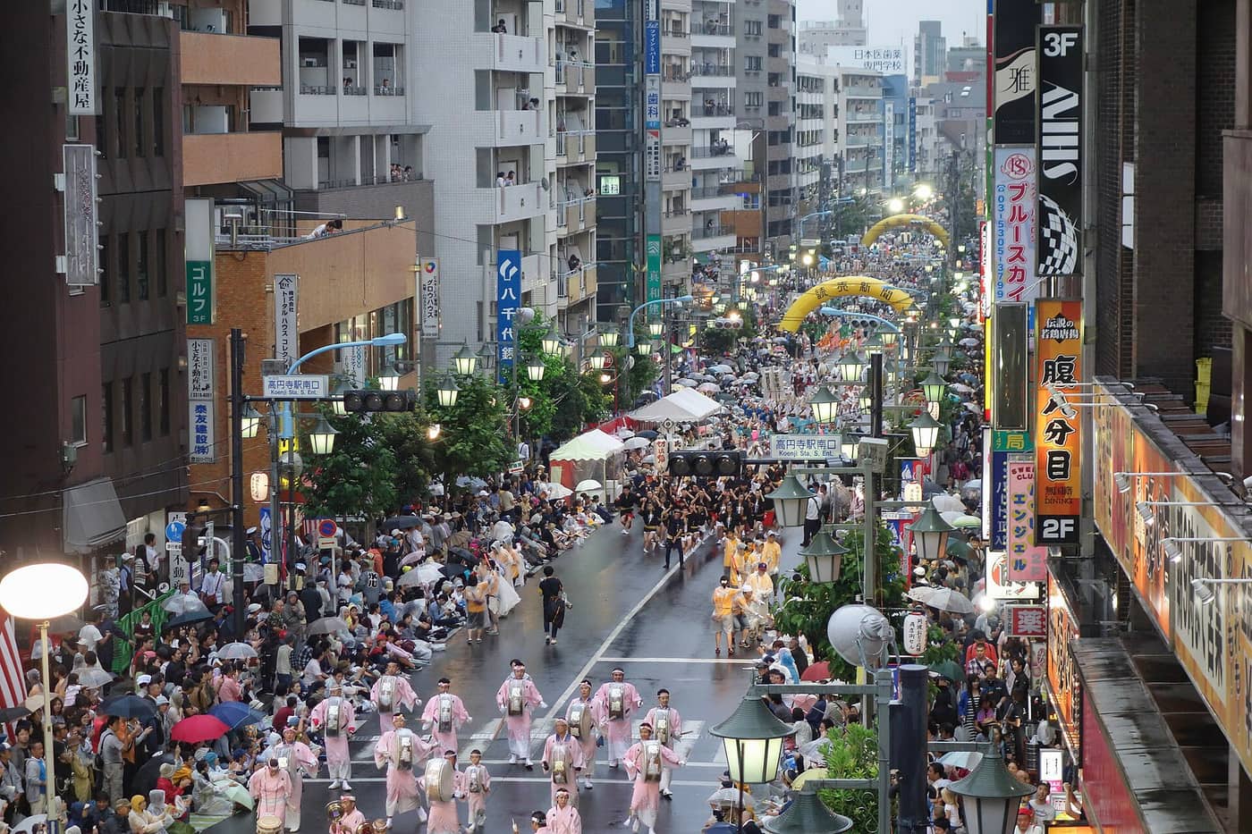 Crowds lining a Koenji street as Awa Odori troupes dance between them