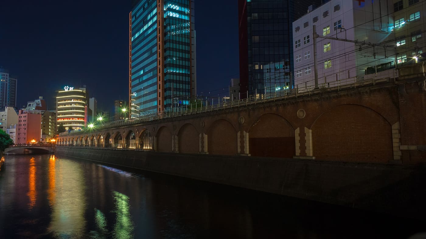 The brick Manseibashi viaduct over the Kanda River near Akihabara at night
