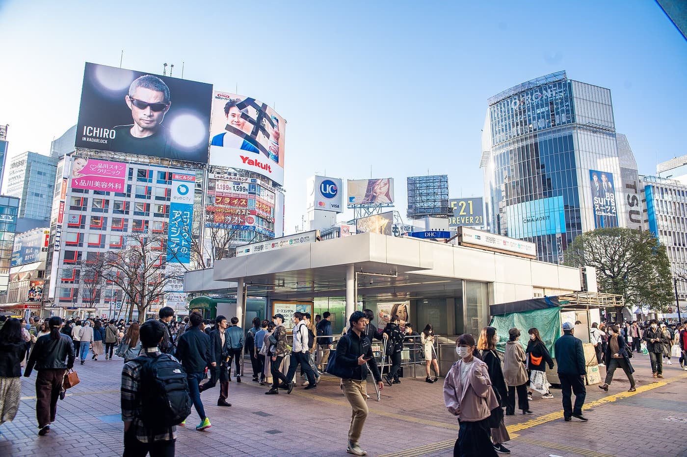 Crowds crossing Hachiko Square outside Shibuya Station under the big screens