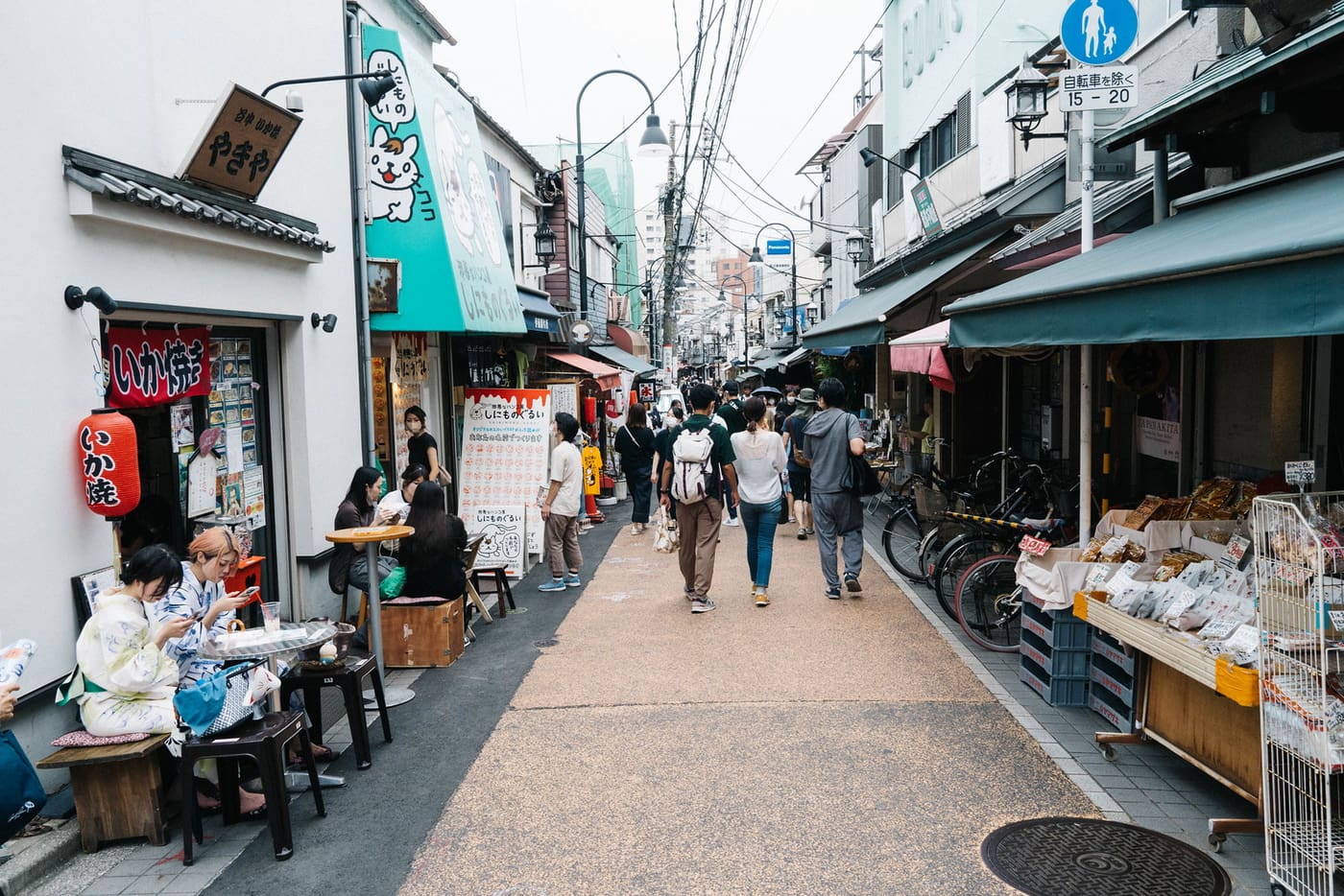 Shoppers walking the old Yanaka Ginza shopping street in the afternoon