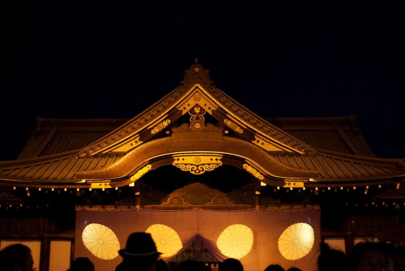 The main hall of Yasukuni Shrine lit up at night during the Mitama Matsuri