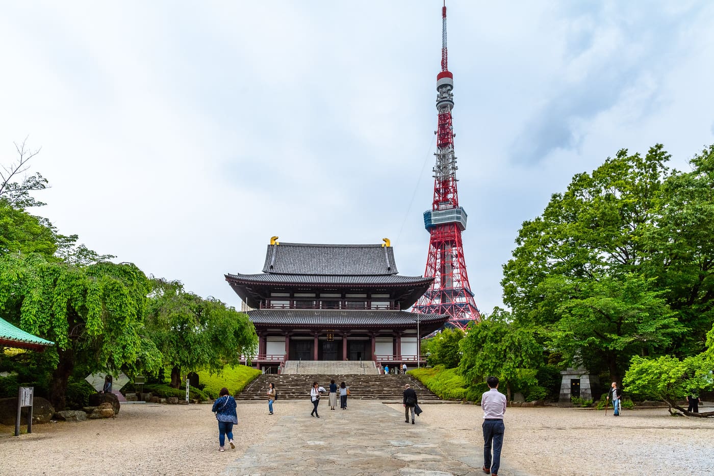 The main hall of Zojo-ji Temple in Shiba with Tokyo Tower rising directly behind it