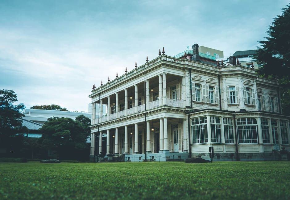 Colonnaded Western-style mansion of Kyu Iwasaki-tei seen across its lawn in Yushima