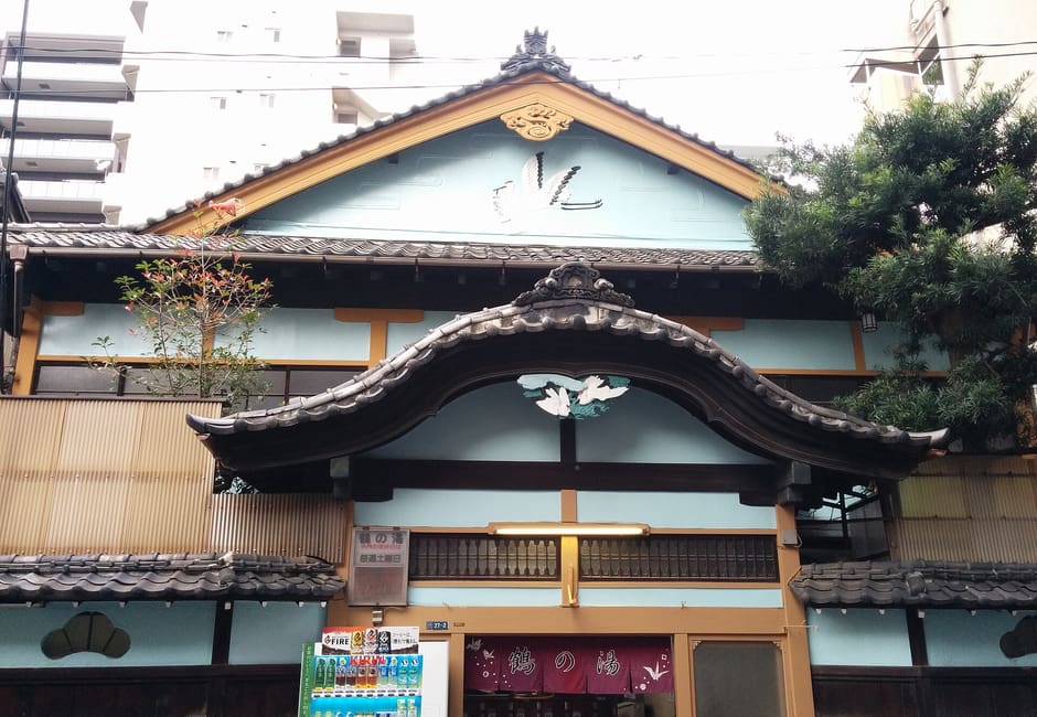 Temple-style facade of Tsurunoyu with its curved gable and crane crest near Asakusabashi