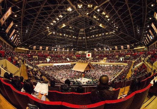 The packed arena of Ryogoku Kokugikan during a January grand sumo tournament