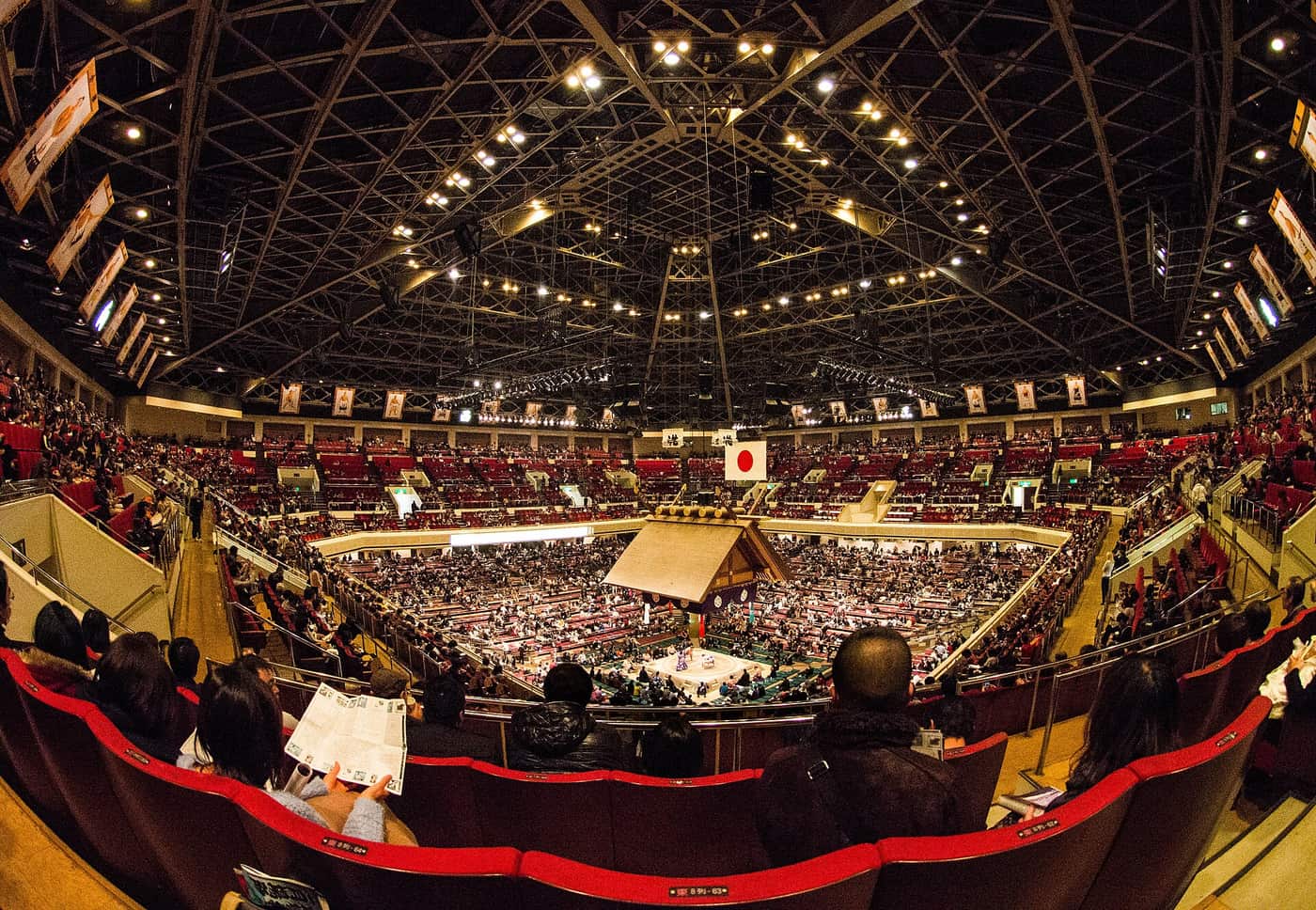 The packed arena of Ryogoku Kokugikan during a January grand sumo tournament