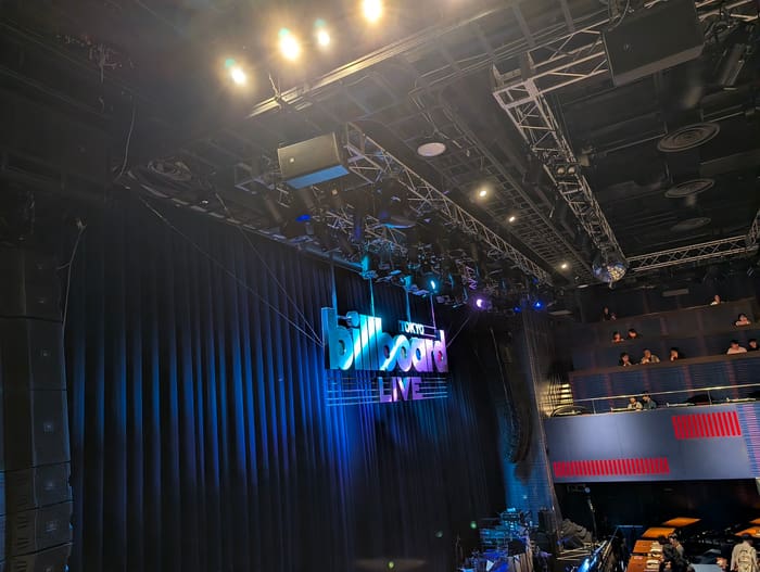 Stage and curtain under the Billboard Live logo inside the Tokyo Midtown club