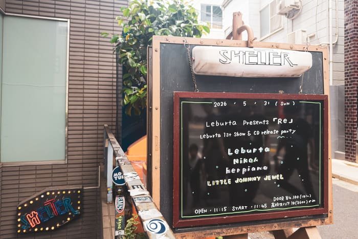 SHELTER sign and the day's chalkboard bill at the live house entrance in Shimokitazawa