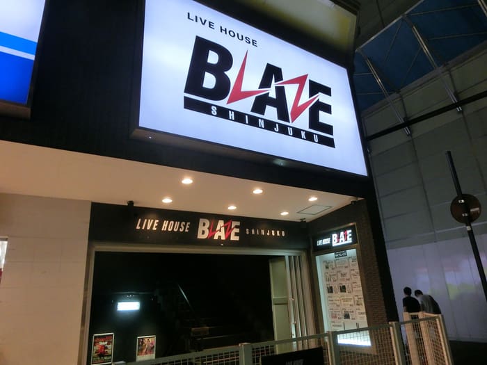 Lit LIVE HOUSE BLAZE sign above the entrance of the Shinjuku venue at night