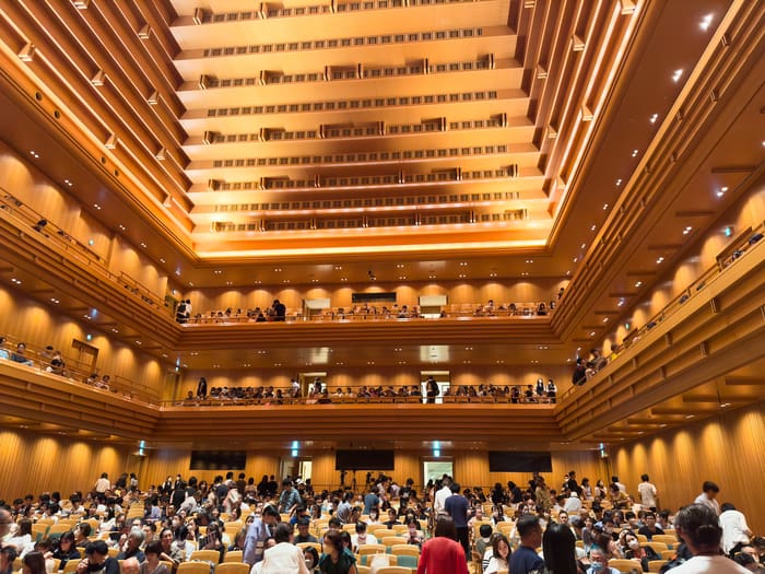 Tall pyramid ceiling and wooden balconies of the Tokyo Opera City Concert Hall